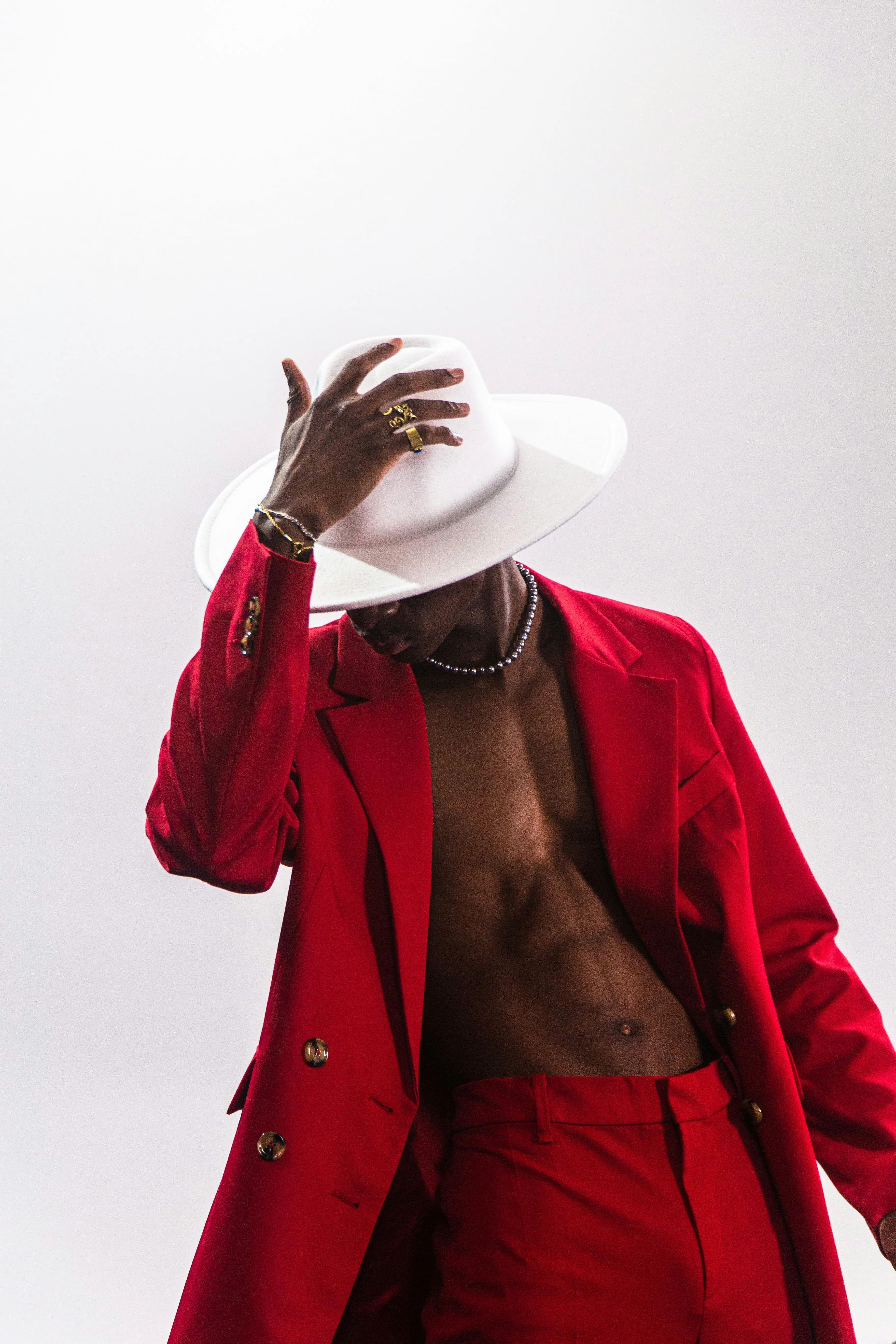 a-person-wearing-a-red-coat-and-white-hat